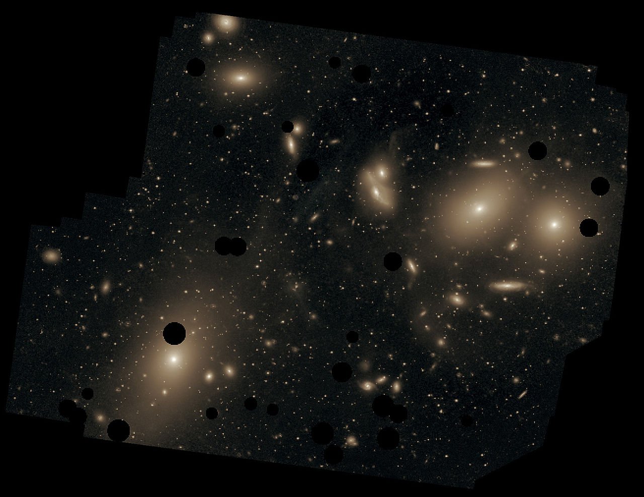 The Virgo Cluster of galaxies, with the giant elliptical galaxy M87 at the upper left. 