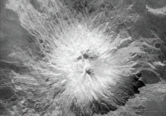 Sapas Mons, a large volcano on Venus, is about 400 km in diameter. It was imaged by the Magellan spacecraft, with a light source coming from the left side of the image.