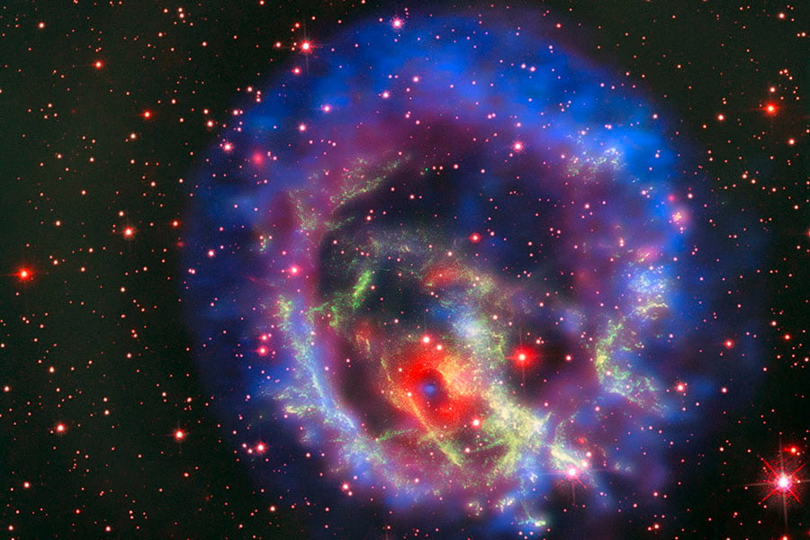 A composite image of the supernova 1E0102.2-7219. A neutron star, the ultra dense core of a massive star that collapses and undergoes a supernova explosion, is found at its center. 