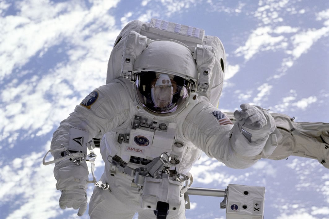 A NASA astronaut in a space suit. Image credit: NASA, CC0 Public Domain via Negative Space