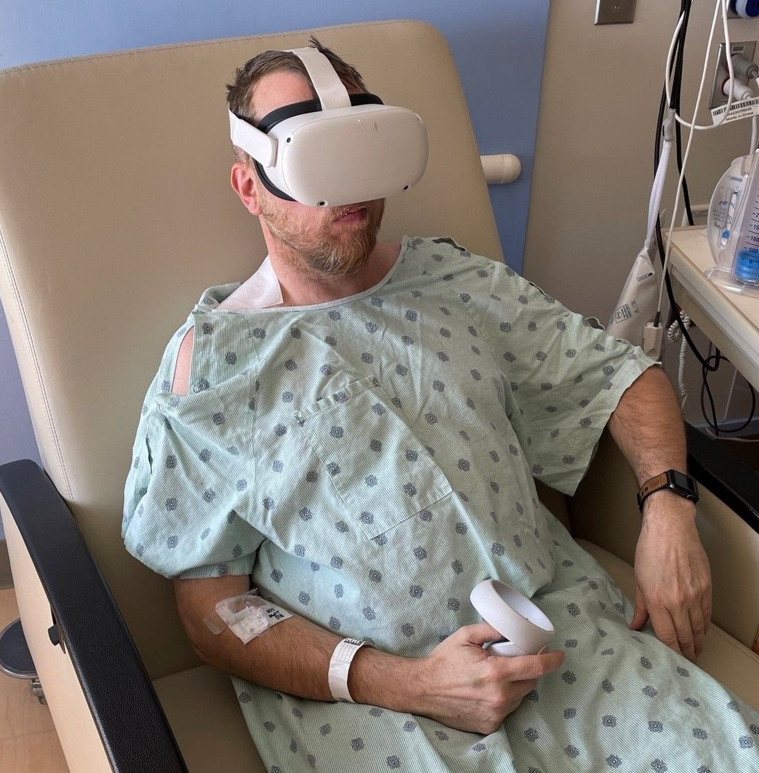 A patient experiencing balance issues wears video goggles for measuring head and eye movements. The dial he's holding allows him to rate his levels of motion sickness as he tests out different head motions. A similar setup will be used on riders just after they exit the Kraken. 