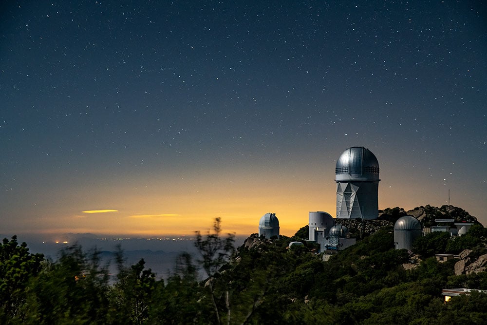 The Dark Energy Spectroscopic Instrument sits atop the Mayall 4-Meter Telescope at Kitt Peak National Observatory. DESI’s early data gathered in 2020 and 2021 is now publicly available. 