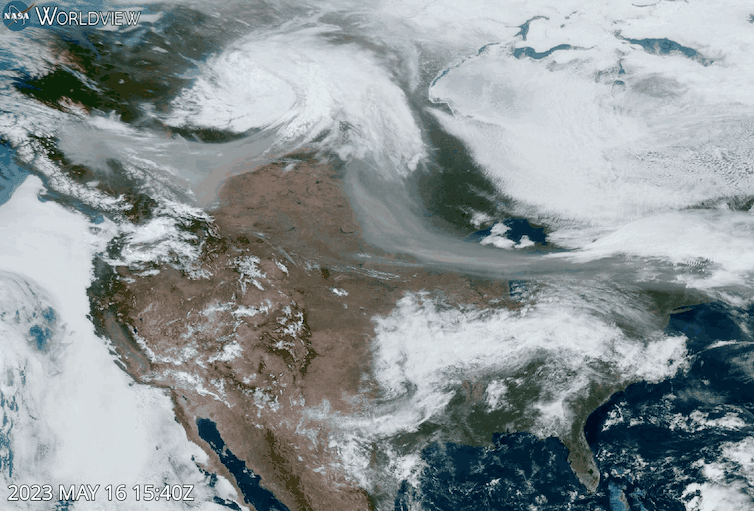A satellite animation shows smoke moving from fires in Alberta across Canada and into New England.