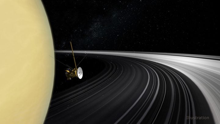 An artist's concept of the Cassini orbiter crossing Saturn's ring plane. 