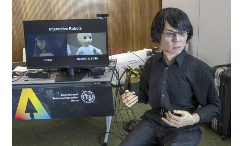 UN tech agency rolls out human-looking robots for questions at a Geneva news conference