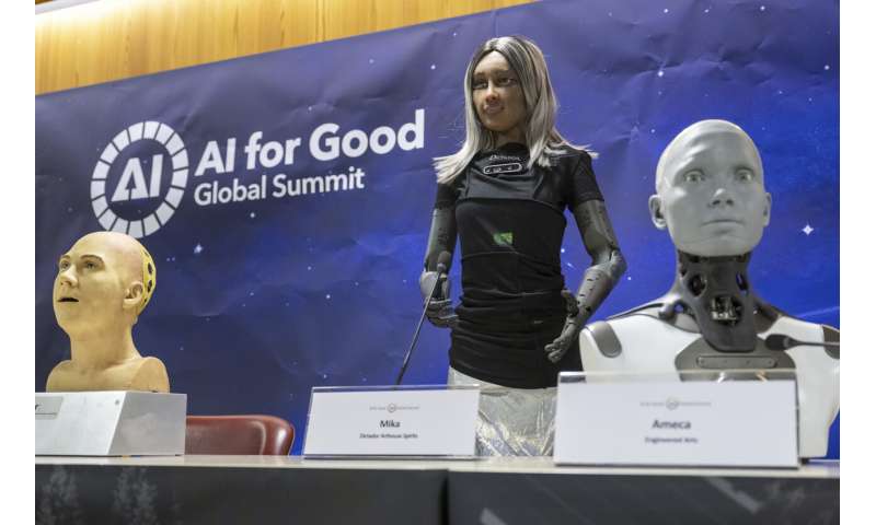 UN tech agency rolls out human-looking robots for questions at a Geneva news conference