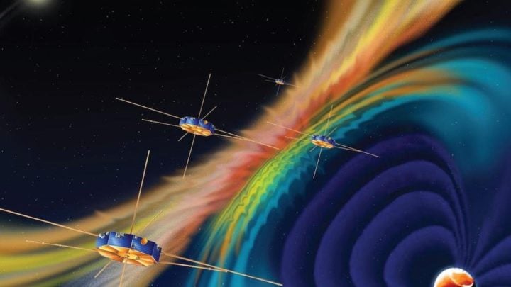 An artist's rendering of the four satellites in NASA's Magnetospheric Multiscale mission flying through Earth's magnetic field. 