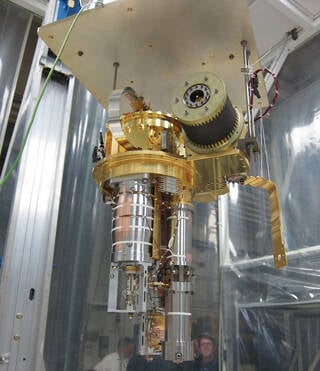 XRISM’s Resolve CSI (Calorimeter Spectrometer Insert) prepares for testing at Goddard in July 2019 in this photo. The CSI allows X-ray light focused by the X-ray mirrors at the front of the spacecraft to reach the Resolve detector. The hardware here includes the sensitive detector assembly in addition to the cooling system that, together with the JAXA dewar, can achieve the cold temperatures required to enable XRISM science. 