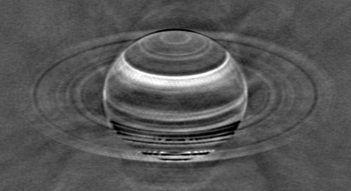 Radio image of Saturn taken with the VLA in May 2015, with the brighter radio emissions from Saturn and its rings subtracted to enhance the contrast in the fainter radio emissions between the various latitudinal bands in the atmosphere.