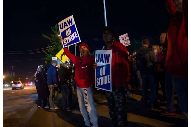 UAW members picket outside of the Local 900 headquarters across the street from a Ford assembly plant in Wayne, Michigan on September 15, 2023