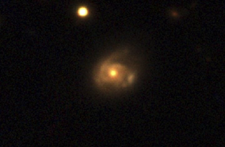 Swift J0230 occurred over 500 million light-years away in a galaxy named 2MASX J02301709+2836050, captured here by the Pan-STARRS telescope in Hawaii. 