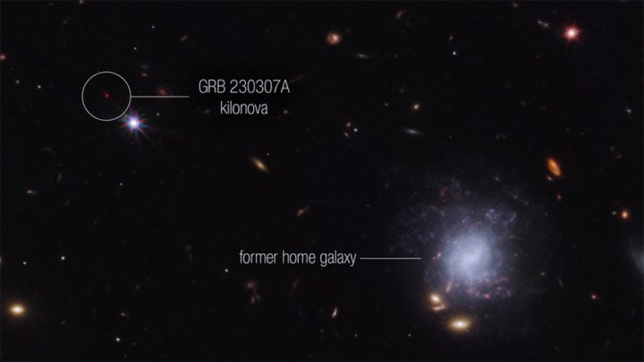 This image from Webb’s NIRCam (Near-Infrared Camera) instrument highlights GRB 230307A’s kilonova and its former home galaxy among their local environment of other galaxies and foreground stars. The neutron stars were kicked out of their home galaxy and traveled the distance of about 120,000 light-years, approximately the diameter of the Milky Way galaxy, before finally merging several hundred million years later. 