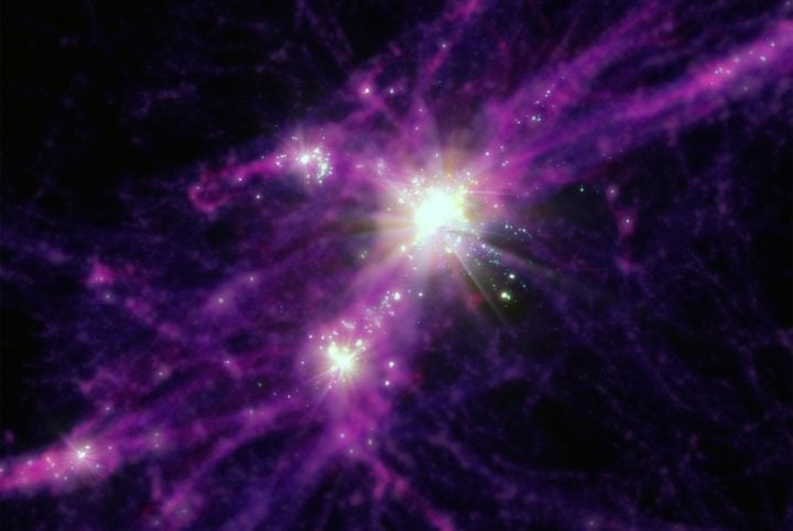 Artist conception of early starbursting galaxies. Stars and galaxies are shown in the bright white points of light, while the more diffuse dark matter and gas are shown in purples and reds. 