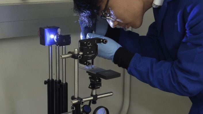 An investigator at University of California Santa Barbara prepares the camera and work light for recording images from the Gaucho Lung investigation prior to launch. 