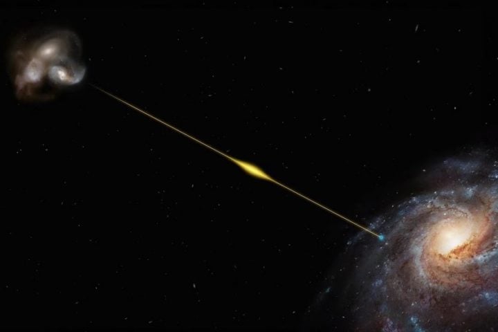 An artist’s impression (not to scale) illustrates the path of the fast radio burst FRB 20220610A, from the distant galaxy where it originated all the way to Earth, in one of the Milky Way’s spiral arms. It’s so far away its light took eight billion years to reach us, making FRB 20220610A the most distant fast radio burst found to date. 