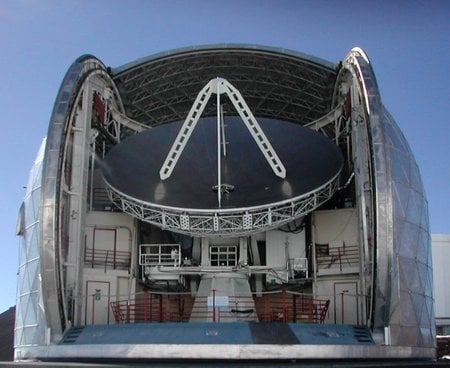 The 10.4-meter Leighton Telescope of CSO prior to disassembly. The reflecting surface consists of 84 aluminum honeycomb panels and weighs 10,000 pounds with its supporting truss.
