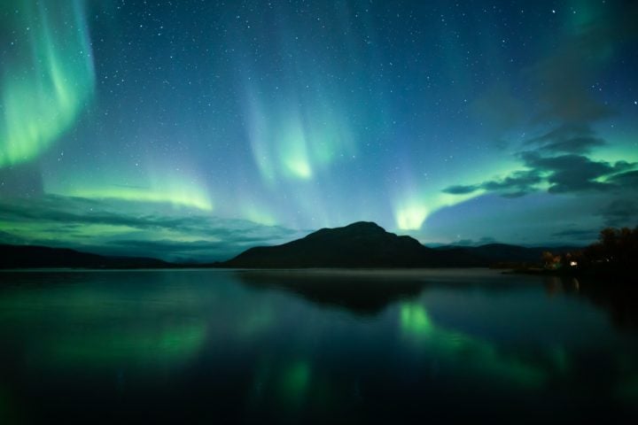 A normal aurora consists of glowing curtains of red, green and blue. An enhanced aurora exhibits much more green, possibly caused by the same physical process that creates Steve and the picket fence. Because enhanced auroras are more common, UC Berkeley researchers plan to probe them first to determine what conditions in the upper atmosphere cause the phenomena.