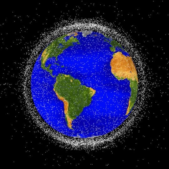 A computer-generated image of trackable objects in low Earth orbit. Each dot represents an object, and around 95% of them are debris. The trackable objects are already beginning to form a cloud of debris around Earth, but there are millions of smaller pieces that can’t be tracked from the ground. 