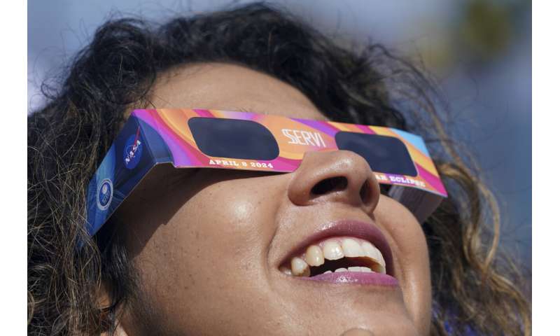 A total solar eclipse races across North America as clouds part along totality