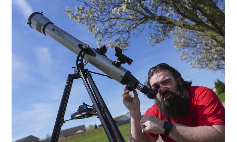 A total solar eclipse races across North America as clouds part along totality