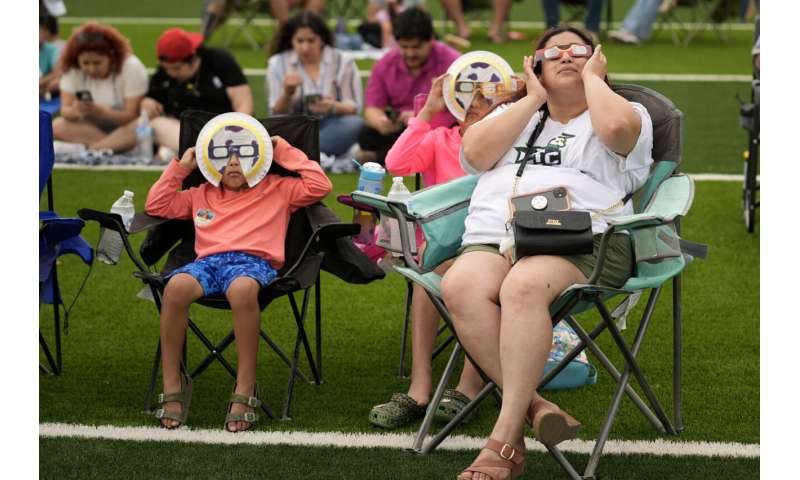 A total solar eclipse races across North America as clouds part along totality