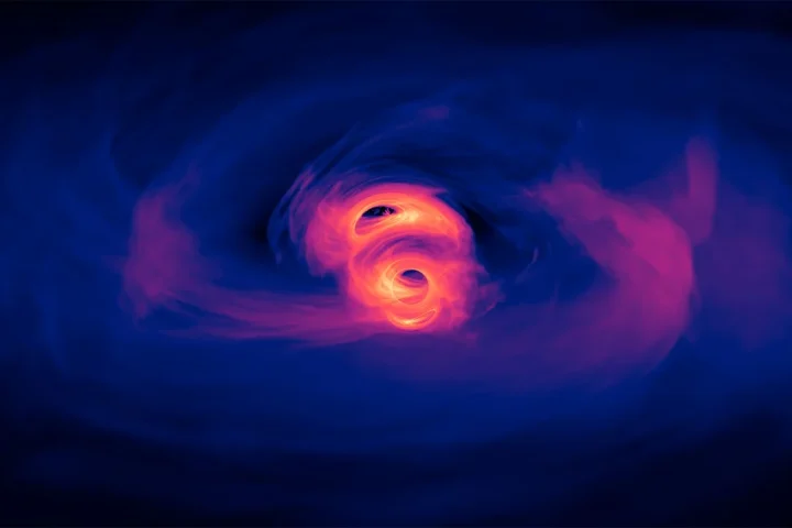 A visualization of two supermassive black holes in orbit around each other (image by NASA's Goddard Space Flight Center/Scott Noble; simulation data, d'Ascoli et al. 2018)