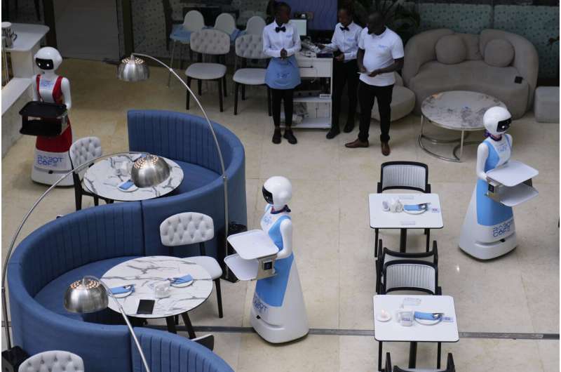 Robot waiters in Kenya create a buzz. But there are concerns about what it means for human labor