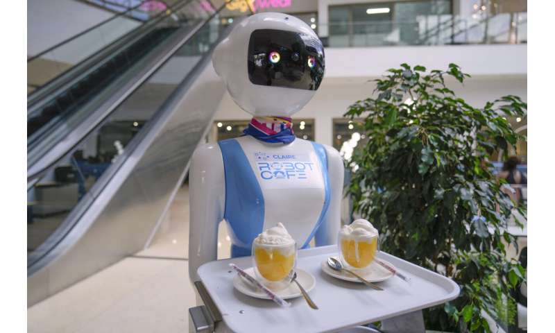 Robot waiters in Kenya create a buzz. But there are concerns about what it means for human labor