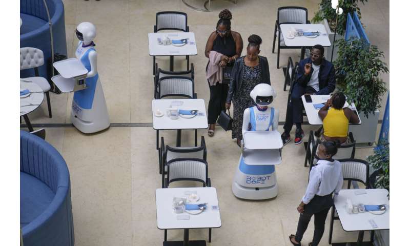 Robot waiters in Kenya create a buzz. But there are concerns about what it means for human labor