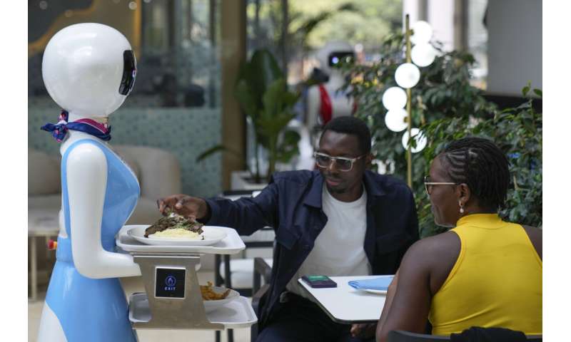 Robot waiters in Kenya create a buzz. But there are concerns about what it means for human labor