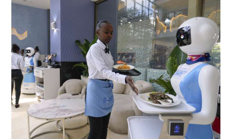 Robot waiters in Kenya create a buzz. But there are concerns about what it means for human labor