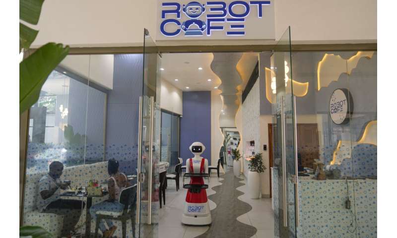 Robot waiters in Kenya create a buzz. But there are concerns about what it means for human labor