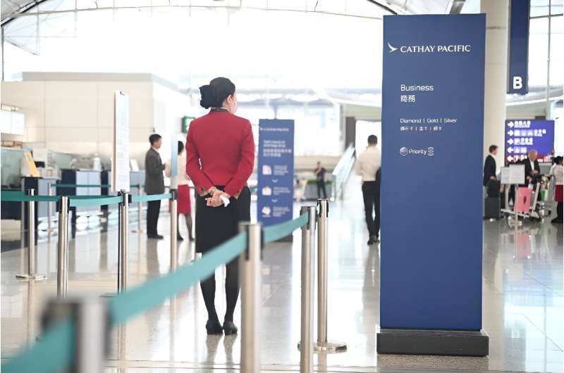 A Cathay Pacific staff is seen at the international airport in Hong Kong