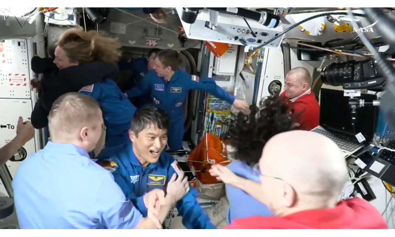 NASA's stuck astronauts welcome their newly arrived replacements to the space station