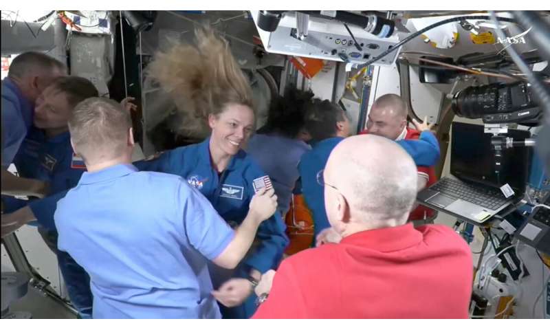 NASA's stuck astronauts welcome their newly arrived replacements to the space station