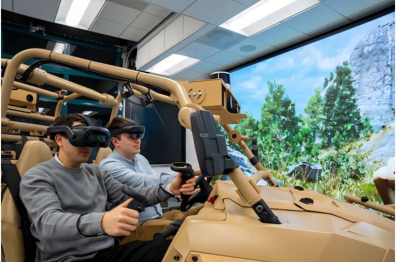 Inside the University of Michigan-led Automotive Research Center (ARC), researchers and students work on the next generation of military vehicles. Here, the team works on an autonomous vehicle that will be fully immersed in a digital environment for experimentation. Credit: Levi Hutmacher/University of Michigan, College of Engineering, Communications and Marketing Off-road autonomy and digital twins