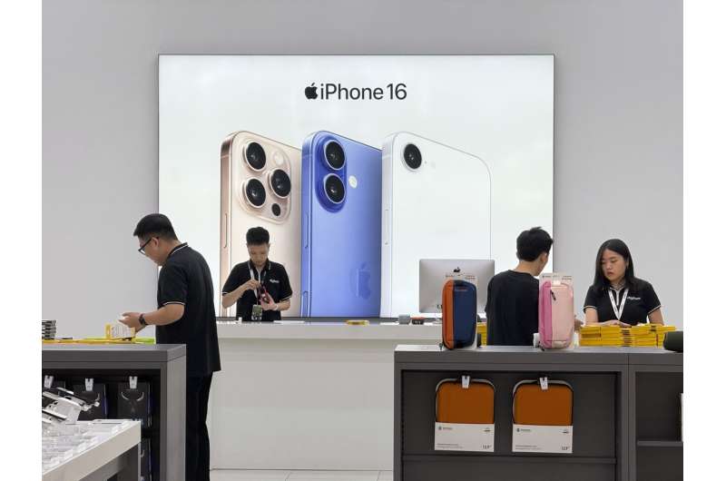 Sales staffs work at an Apple shop in Hanoi, Vietnam Thursday, April 10, 2025. Credit: AP Photo/Hau Dinh, File Apple has had few incentives in the past to start making iPhones in US