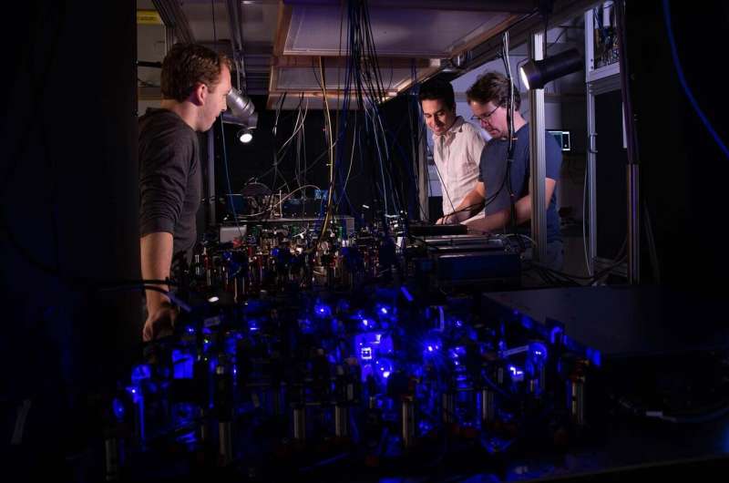 Adam Shaw, Ivaylo Madjarov and Manuel Endres work on their laser-based apparatus at Caltech. Credit: Caltech Controlling quantum motion and hyper-entanglement