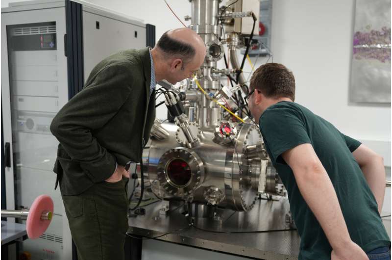 Professor Richard Curry and Dr. Mason Adshead with the Platform for Nanoscale Advanced Materials Engineering tool used to place single atoms of tin into diamond. Credit: University of Manchester. Credit: University of Manchester. Breakthrough in quantum materials: UK Scientists achieve precision activation of quantum defects in diamond