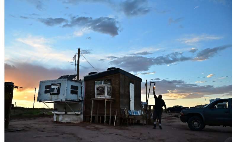 Elbert Yazzie's mobile home turns into a furnace in the summer, and he has already lost one member of his extended family to heat stroke