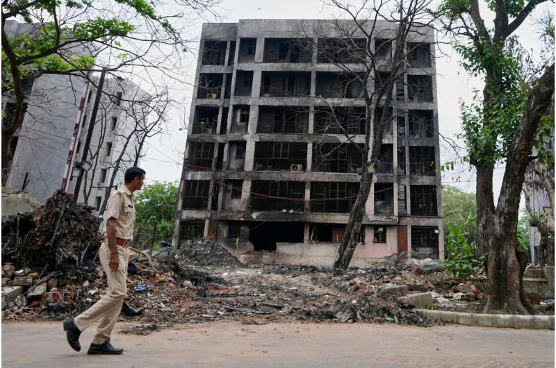 A policeman walks past buildings damaged in the June 12 Air India plane crash in Ahmedabad, India, Saturday, July 12, 2025. Credit: AP Photo/Ajit Solanki What the ‘black box’ can tell us about plane crashes