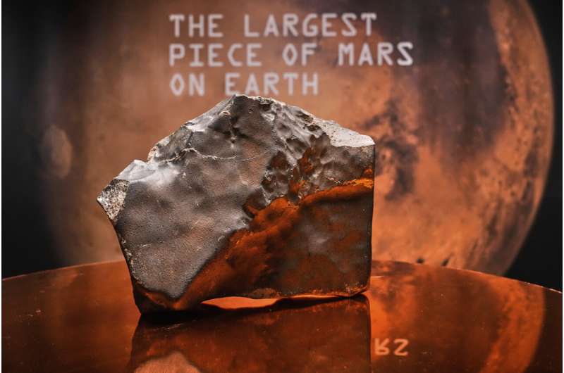 A Martian meteorite, weighing 54.388 lbs. (24.67 kg), said to be the largest piece of Mars on Earth, estimated at $2 - 4 million, is displayed at Sotheby's, in New York, Wednesday, July 9, 2025, part of their Geek Week auction, July 16, 2025. Credit: AP Photo/Richard Drew The biggest piece of Mars on Earth is going up for auction in New York