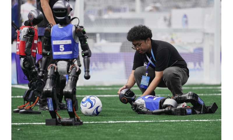 Photos of Beijing's World Humanoid Robot Games show how a human touch is still needed