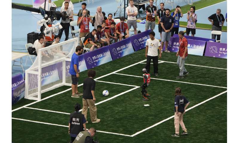 Photos of Beijing's World Humanoid Robot Games show how a human touch is still needed