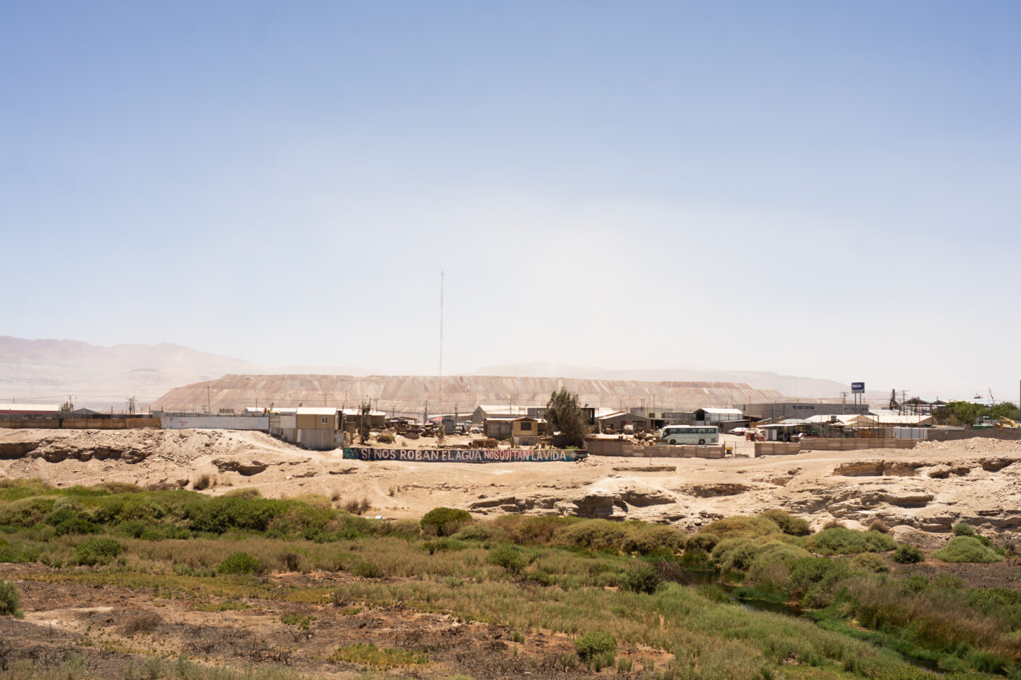 Graffiti on the wall of an industrial park near the Loa River outside the city of Calama