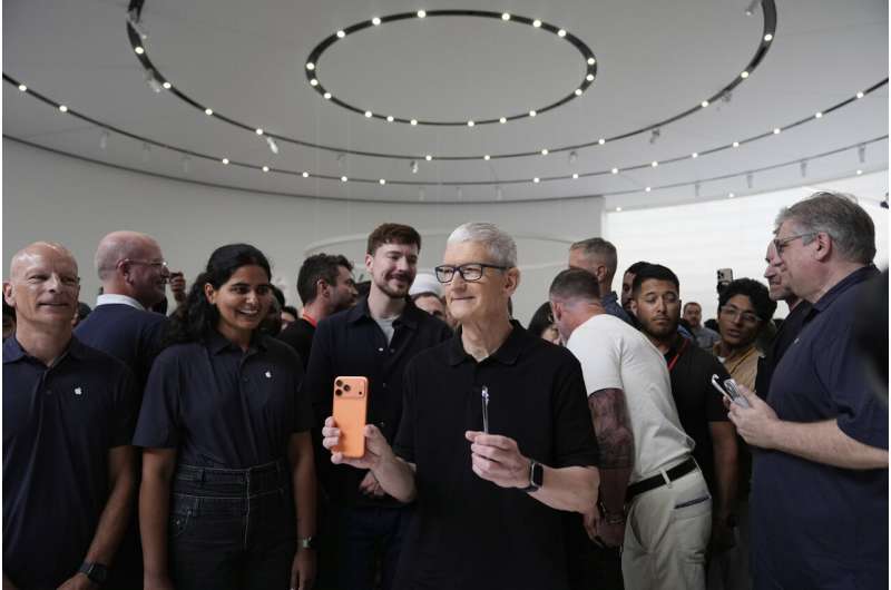 Apple CEO Tim Cook holds new iPhones during an announcement of new products at Apple Park on Tuesday, Sept. 9, 2025, in Cupertino, Calif. Credit: AP Photo/Godofredo A. Vásquez Apple's iPhone 17 line-up includes a new ultra-thin model and $100 price hike for Pro model