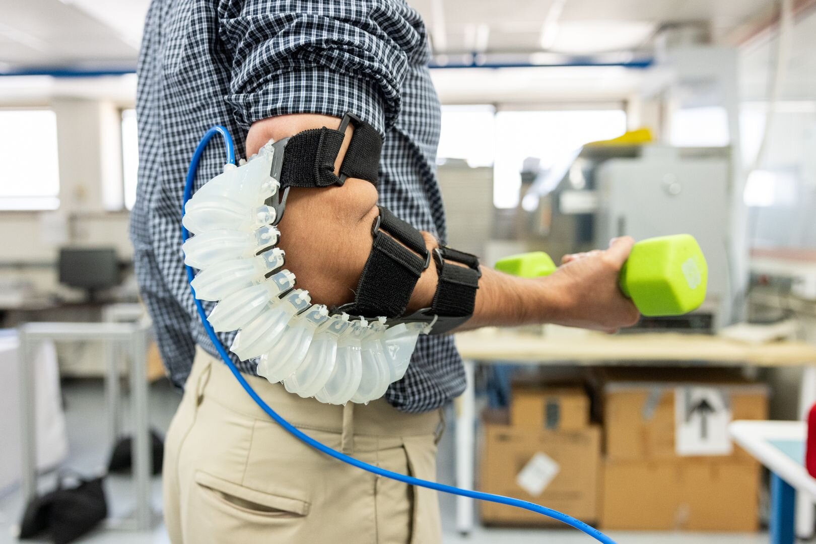 Pneumatically actuated, soft wearable robotic elbow exoskeleton for ...