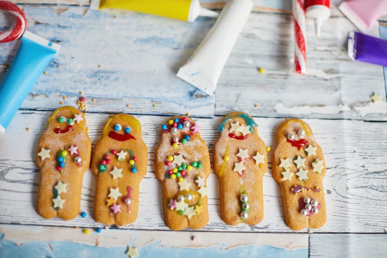 Cookies decorated with crooked dabs of frosting and candies