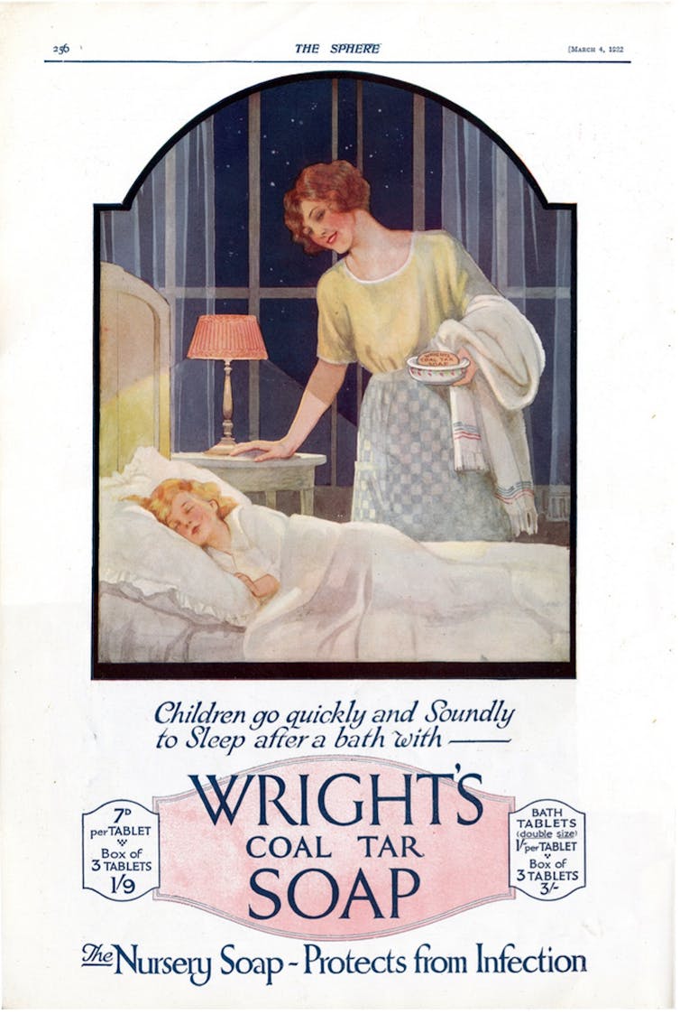 A smiling woman stands over a sleeping child in an ad for coal tar soap.