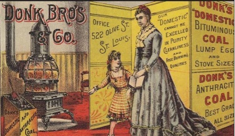An ad with a woman and child with a coal stove.